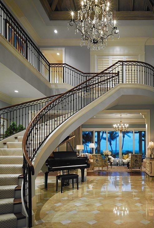 A luxurious grand foyer in a Palm Beach Traditional design project.